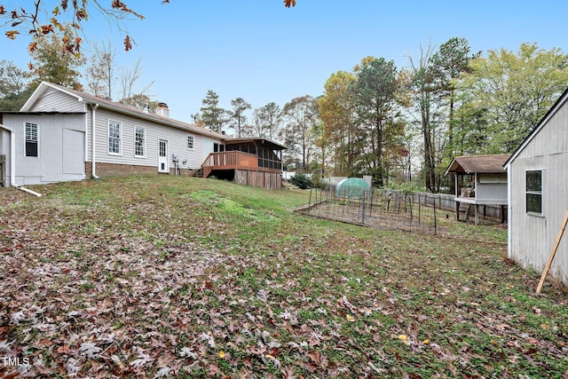 view of yard featuring an outbuilding and a deck