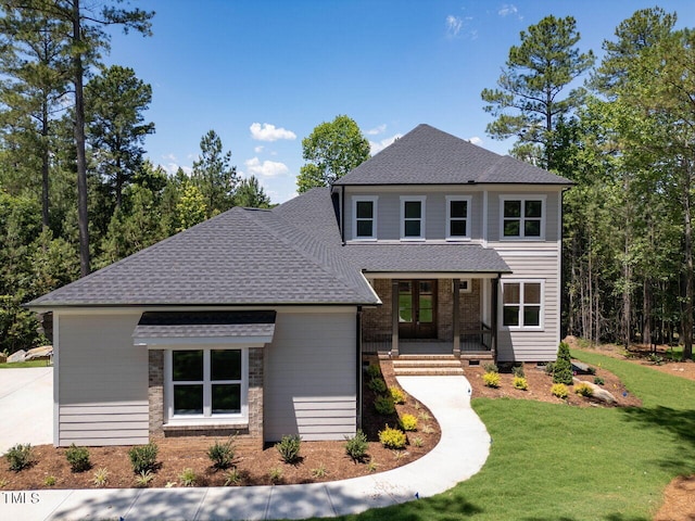 103 Brandy Ml, Pittsboro, NC 27312 - view of front of house with a shingled roof, covered porch, and a front lawn