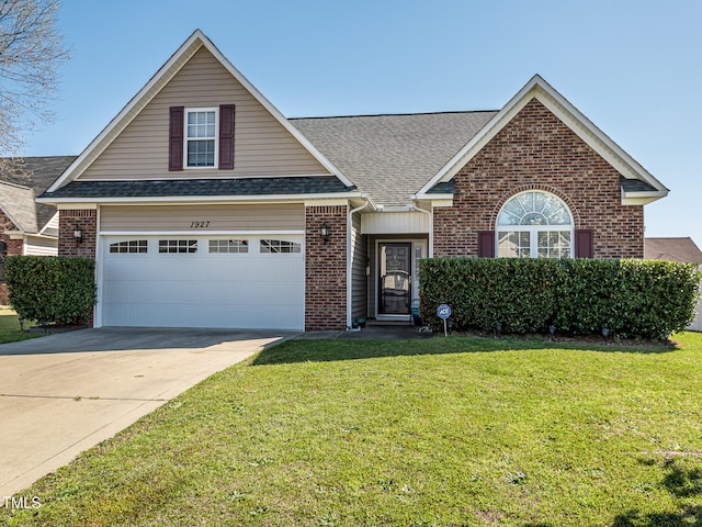 view of front of house with a garage and a front yard