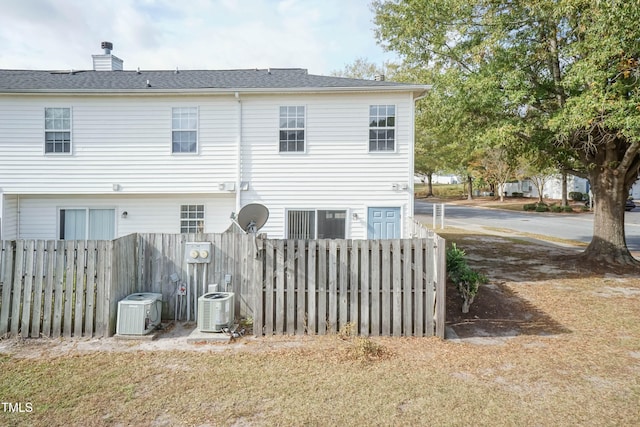 back of property with central air condition unit