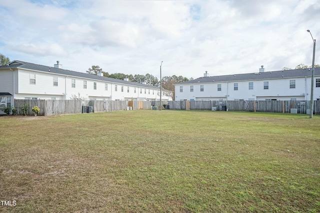 view of yard with central AC unit