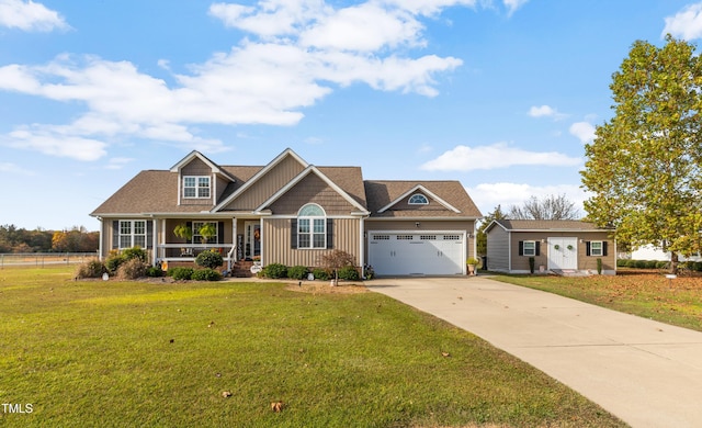 craftsman-style house with a garage, a porch, and a front yard