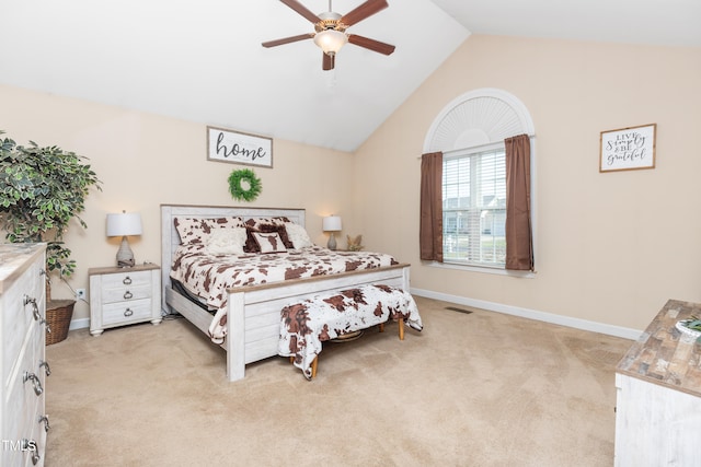 carpeted bedroom featuring ceiling fan and vaulted ceiling