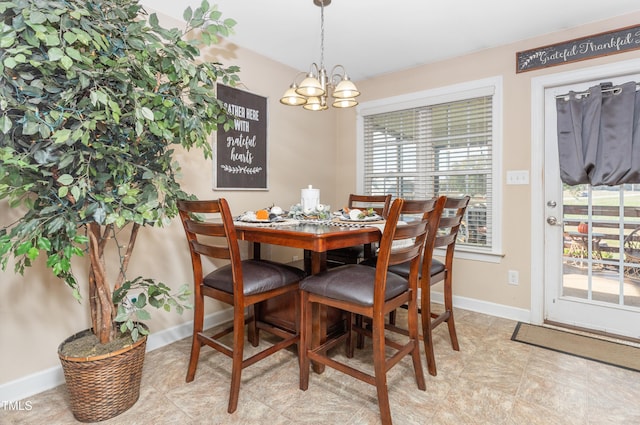 dining space featuring an inviting chandelier