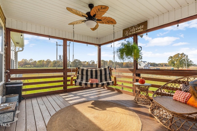 exterior space featuring ceiling fan