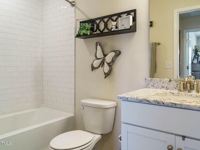 full bathroom with vanity, toilet, and tiled shower / bath combo