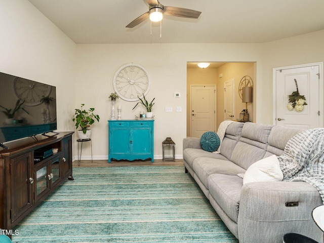 living room featuring hardwood / wood-style flooring and ceiling fan