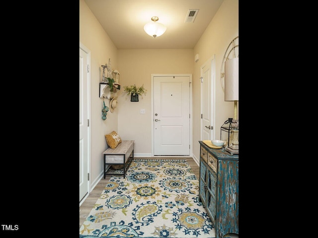 entryway with light hardwood / wood-style flooring