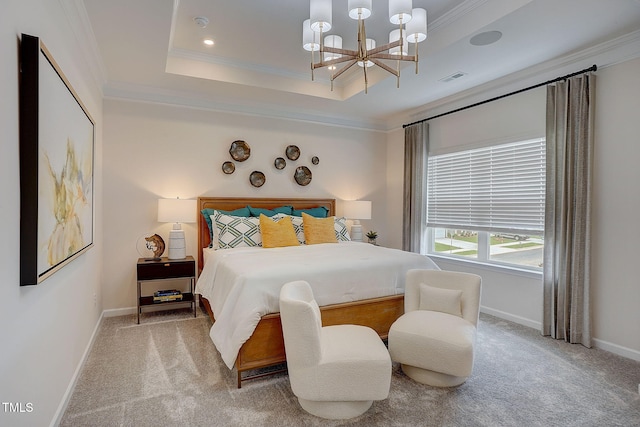 carpeted bedroom featuring ornamental molding, a chandelier, and a tray ceiling