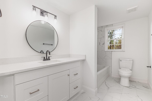 full bathroom with vanity, toilet, and tiled shower / bath