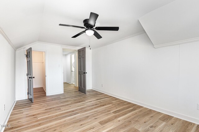 additional living space with light wood-type flooring, vaulted ceiling, and ceiling fan