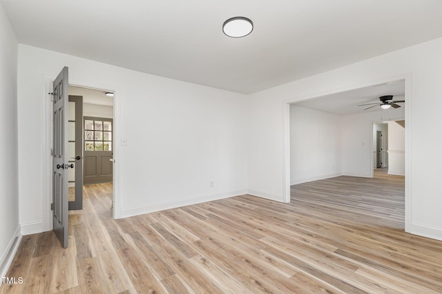 unfurnished room featuring ceiling fan and light hardwood / wood-style floors