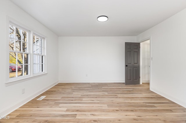 unfurnished room featuring light hardwood / wood-style flooring