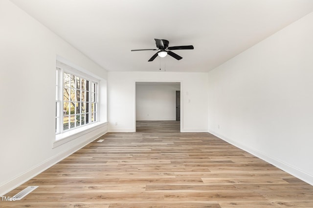 spare room with ceiling fan and light hardwood / wood-style floors