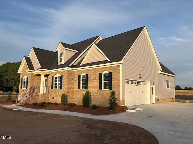 view of property exterior with driveway, a garage, brick siding, and roof with shingles