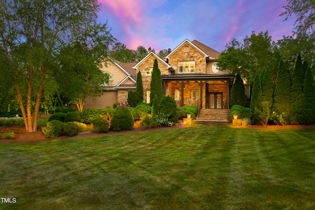 craftsman-style house with a yard