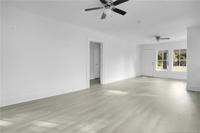 empty room with light hardwood / wood-style flooring and ceiling fan