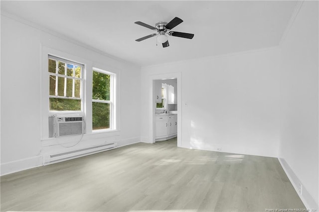 empty room featuring baseboard heating, ornamental molding, light hardwood / wood-style floors, and ceiling fan