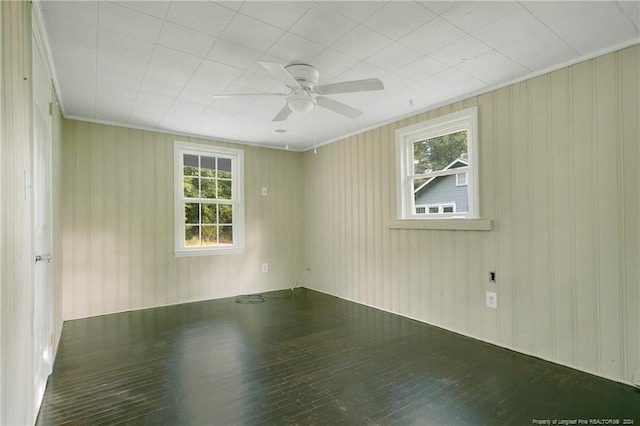 unfurnished room with hardwood / wood-style floors and ceiling fan