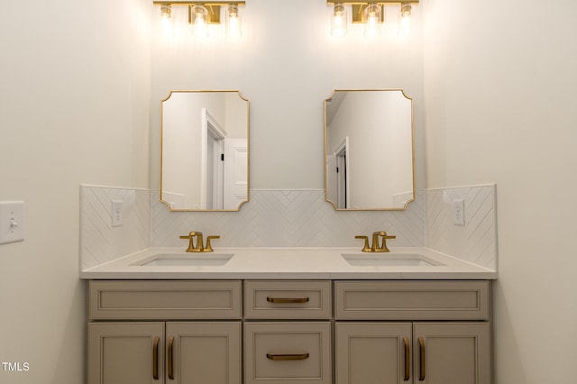 bathroom with vanity and tasteful backsplash