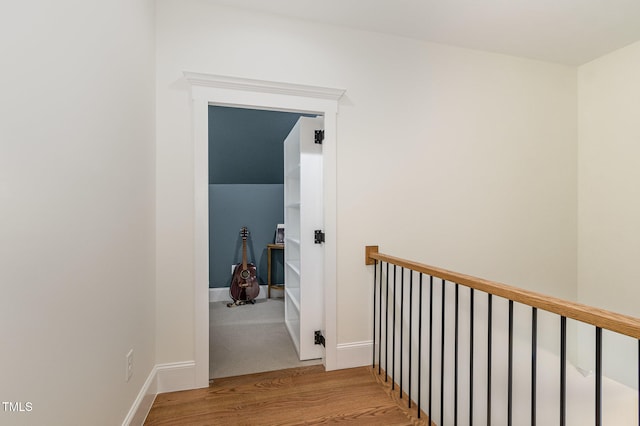 hall with wood-type flooring