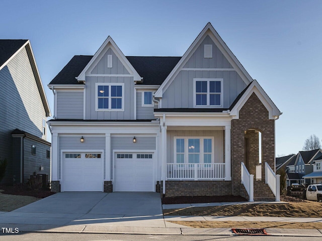 view of front of house featuring a garage and covered porch