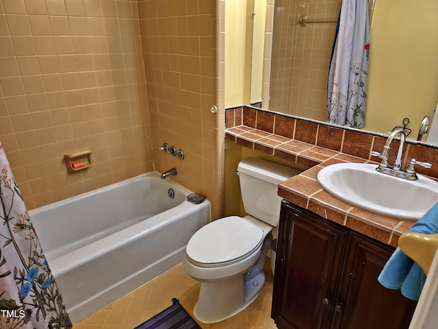 full bathroom featuring toilet, vanity, shower / bath combination with curtain, and tile patterned floors