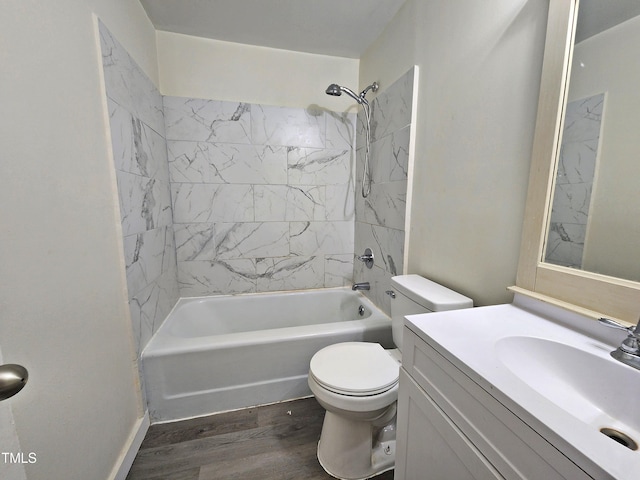 full bathroom with toilet, vanity, tiled shower / bath, and hardwood / wood-style flooring