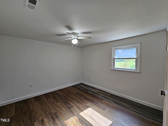 empty room with dark wood-type flooring and ceiling fan