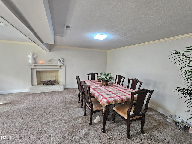 carpeted dining room featuring a textured ceiling, crown molding, and a fireplace