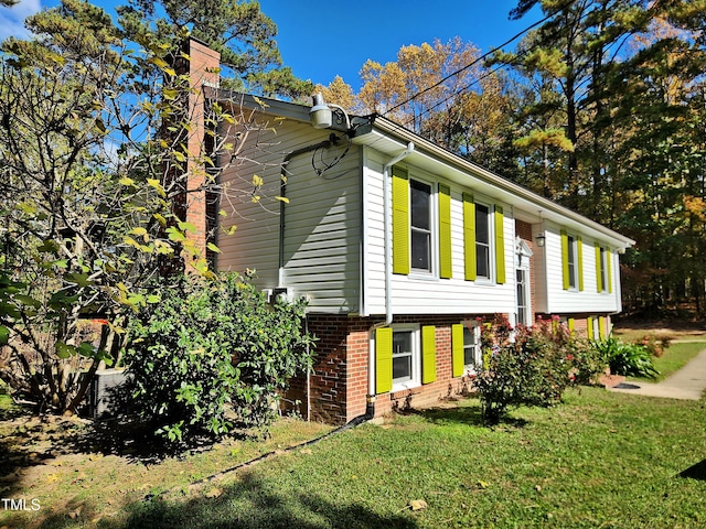 view of home's exterior featuring a lawn