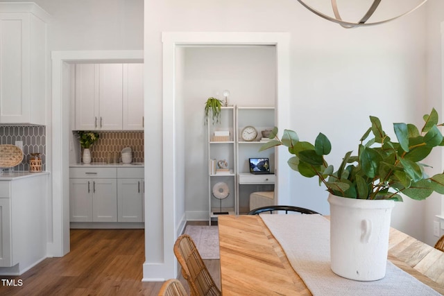 dining space with hardwood / wood-style flooring