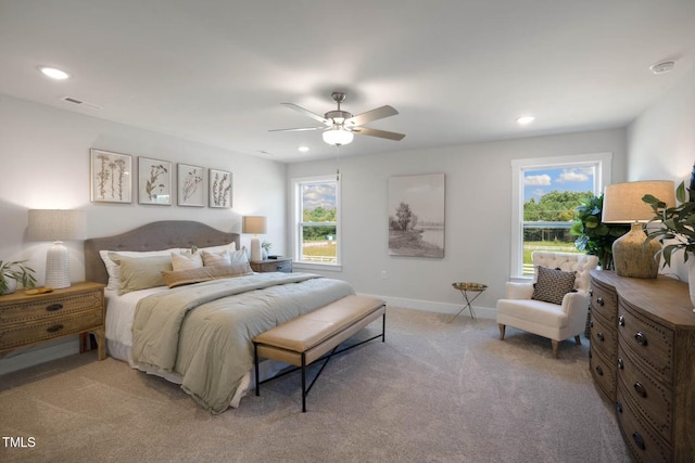 carpeted bedroom featuring ceiling fan