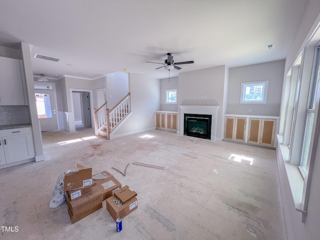 unfurnished living room featuring ceiling fan