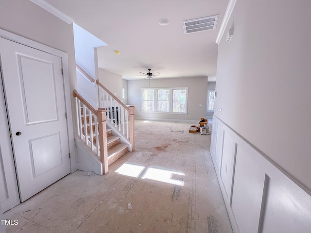 stairway with ceiling fan