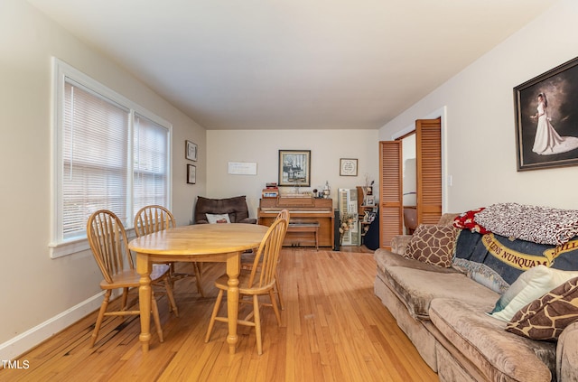 dining area with light hardwood / wood-style floors