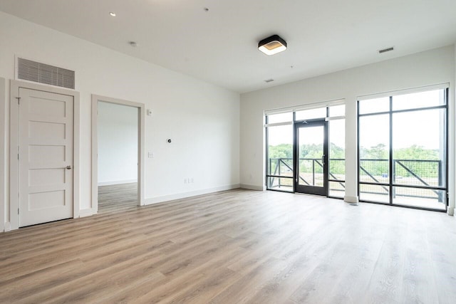 unfurnished room featuring light hardwood / wood-style floors