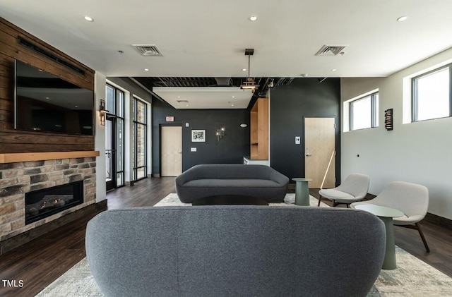 interior space with a fireplace and dark hardwood / wood-style floors