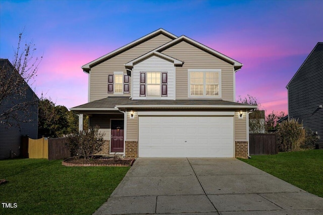 front facade with a yard and a garage