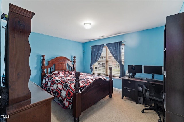 bedroom featuring light carpet