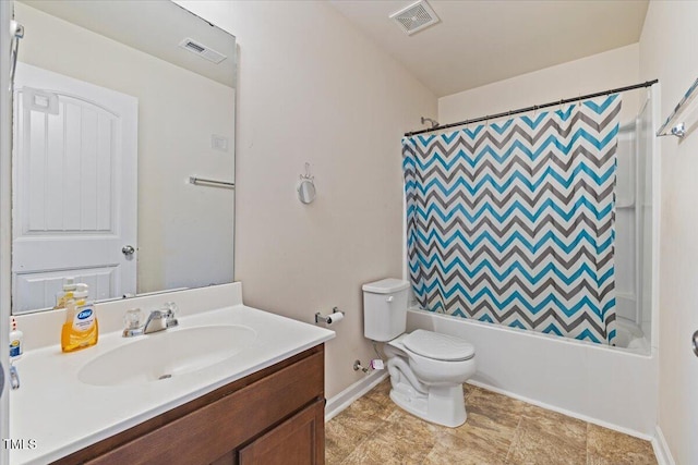 full bathroom with vanity, shower / bath combo with shower curtain, and toilet