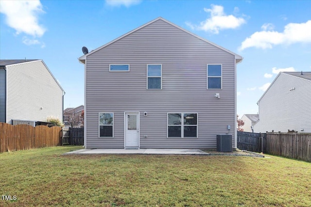 rear view of house featuring central AC unit, a patio area, and a lawn