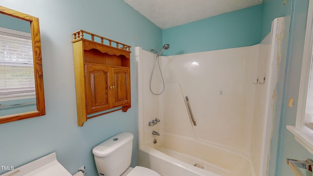 bathroom featuring  shower combination, a textured ceiling, and toilet