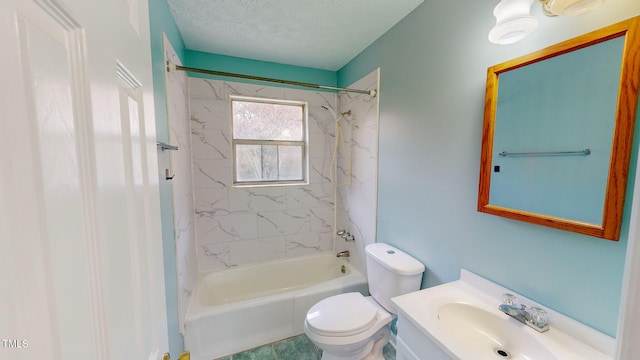 full bathroom featuring tile patterned floors, vanity, a textured ceiling, tiled shower / bath combo, and toilet