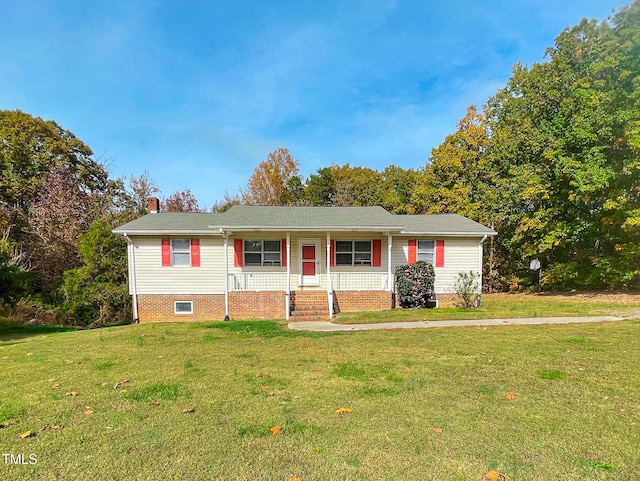 view of front of home featuring a front yard and covered porch