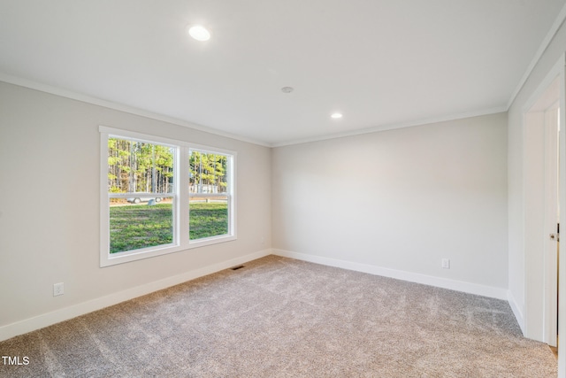 carpeted empty room featuring ornamental molding