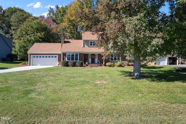 view of front of home featuring covered porch, a garage, and a front yard