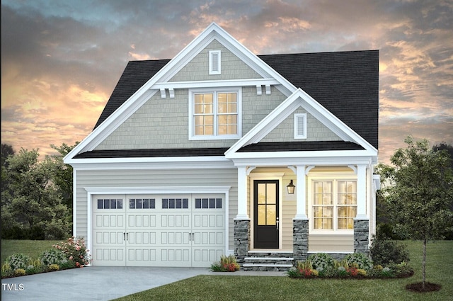 view of front facade featuring a garage and a lawn