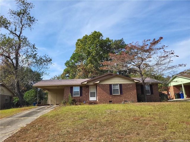 ranch-style home with a front yard and a carport