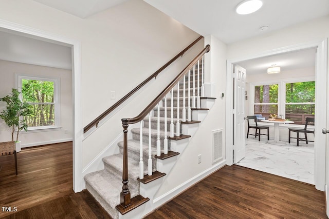 120 Kingston Dr, Chapel Hill, NC 27514 - staircase with healthy amount of natural light, baseboards, and wood finished floors
